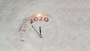 2020 clock in the snow new year change from 2019