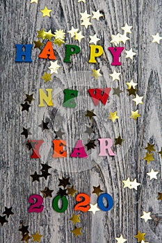2020 Happy New year text for greeting card on wooden background, calendar, invitation