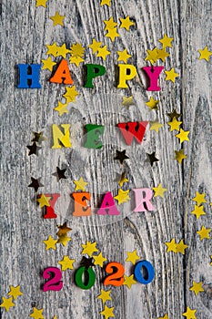 2020 Happy New year text for greeting card on wooden background, calendar, invitation