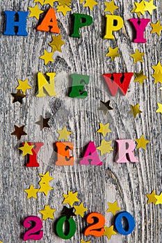 2020 Happy New year text for greeting card on wooden background, calendar, invitation