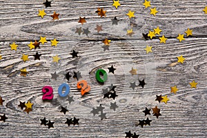 2020 Happy New year text for greeting card on wooden background, calendar, invitation