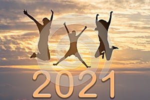 2020 New year concept : Silhouette women jumping on new year 2020