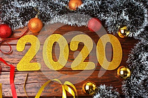 2020 new year, golden numbers on ornate rustic wooden table in festive celebration