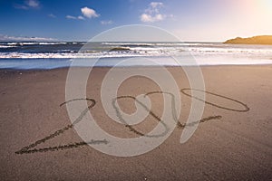 2020 new year on idyllic beach at sunny day