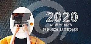 2020 New Years Resolutions with person using a laptop