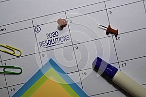 2020 Resolutions text on white calendar background. Reminder or schedule concept