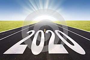 2020 road perspective with rising sun new year card