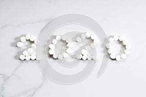 2020-shaped marshmallows stopmotion on white background, happy new year concept