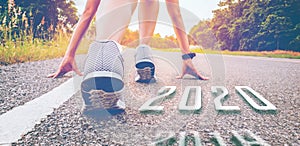 2020 symbolises the start into the new year.Start of people  running on street,with sunset light.Goal of Success