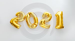 2021 balloon text on white background. Happy New year eve invitation with Christmas gold foil balloons 2021. Flat lay long web