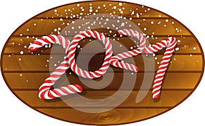 2021 in candy cane design on wooden plaque