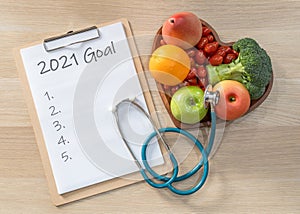 2021 goals on medical clipboard note pad for new year reminder list of yearly planner  health plan for for cholesterol diet