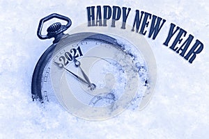2021 Happy New Year, New Year 2021 greeting card, pocket watch in snow, English text