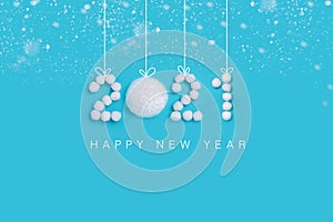 2021 New Years numbers made of white artificial snow on blue background