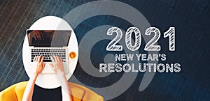 2021 New Years Resolutions with person using a laptop