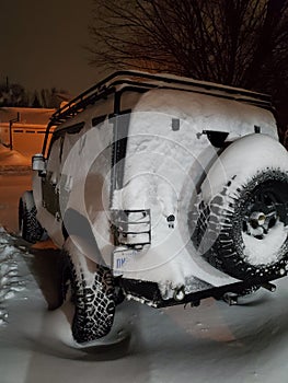 2021 snow storm the jeep wrangler was covered in snow