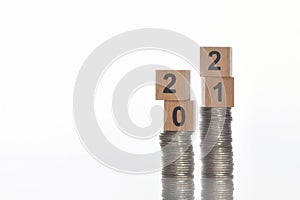 2021 on stack of coins on white background