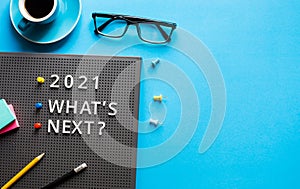 2021 What`s next ? text on work table.trends research and new things.business startup