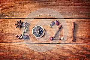 2021 written with Christmas spices and dried fruits on wooden background, new year greetings