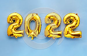 2022 new year foil balloon numbers on sky blue background