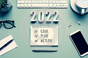 2022 new year goal,plan,action concepts with text on notepad and office accessories