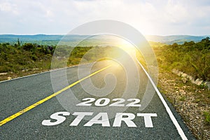 2022 Start, concept photo of asphalt road. Motivational inscription on the road going forward. The beginning of a new path. A