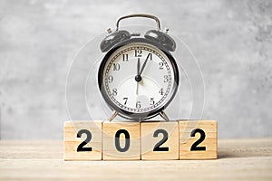 2022 text with clock on table. Resolution, time, plan, goal, motivation, reboot, countdown and New Year holiday concepts