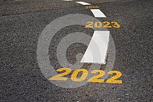 2022 to 2024 on black asphalt road and white marking lines