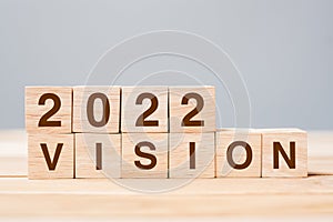 2022 VISION cube block on table background. Resolution, plan, review, goal, start and New Year holiday concepts