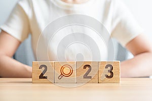 2023 block with magnifying glass icon. SEO, Search Engine Optimization, hiring , Advertising, Idea, Strategy, marketing, Keyword,