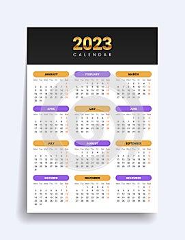 2023 gold calendar. Twelve months on one page. Red Sunday at the end of the week. Vector template
