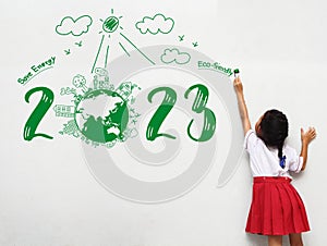 2023 new year Asian little girl holding a paint brush painting creative environmental