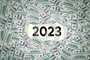 2023 number on torn paper with money background