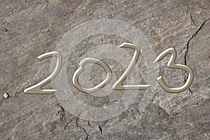 2023, Symbol, Letters, liquid metal on dark stone