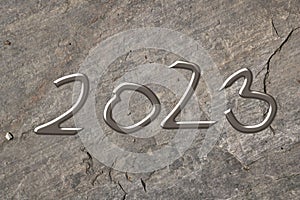2023, Symbol, Letters, liquid metal on dark stone