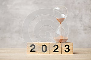 2023 text with hourglass on table. Resolution, time, plan, goal, motivation, reboot, countdown  and New Year holiday concepts