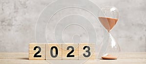 2023 text with hourglass on table. Resolution, time, plan, goal, motivation, reboot, countdown  and New Year holiday concepts