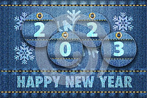 2023 year digits and Happy New Year greetings on blue jeans