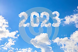 2023 year written on a blue sky of clouds. Concept of happy New year