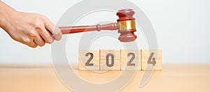 2024 block with judge gavel on table. Law, lawyer, judgment, justice auction and bidding concept