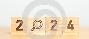 2024 block with magnifying glass icon. SEO, Search Engine Optimization, hiring , Advertising, Idea, Strategy, marketing, Keyword,