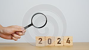 2024 block with magnifying glass. SEO, Search Engine Optimization, hiring , Advertising, Idea, Strategy, marketing, Keyword,
