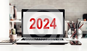 2024 calendar with text on computer screen on the background