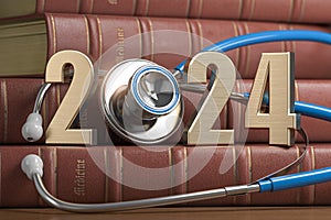 2024 Happy New Year for health care medicine and pharmacy industry. Number 2024 with stethoscope on vintage books of medicine