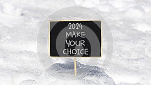 2024 Make your choice symbol. Concept words 2024 Make your choice on beautiful black chalk blackboard. Beautiful white snow