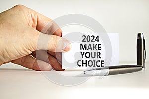 2024 Make your choice symbol. Concept words 2024 Make your choice on beautiful white paper. Beautiful white background. Voter hand
