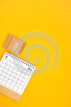 2024 May Desk Calendar On Yellow Background, Position with copy space On Yellow Background