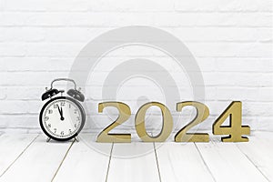 2024 new year and alarm clock on white wood table over white background with copy space , time concept