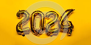 2024 New Year Concept - golden gold copper bronze foil balloon and confetti