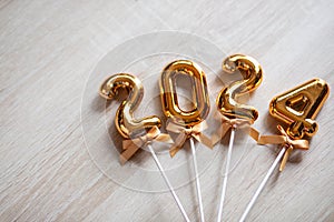 2024 New Year Concept - Orange old gold numbers on wood